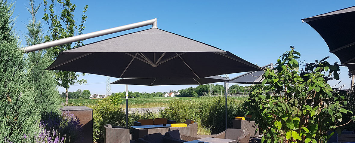 Terrace on golf course with Rialto cantilever umbrellas
